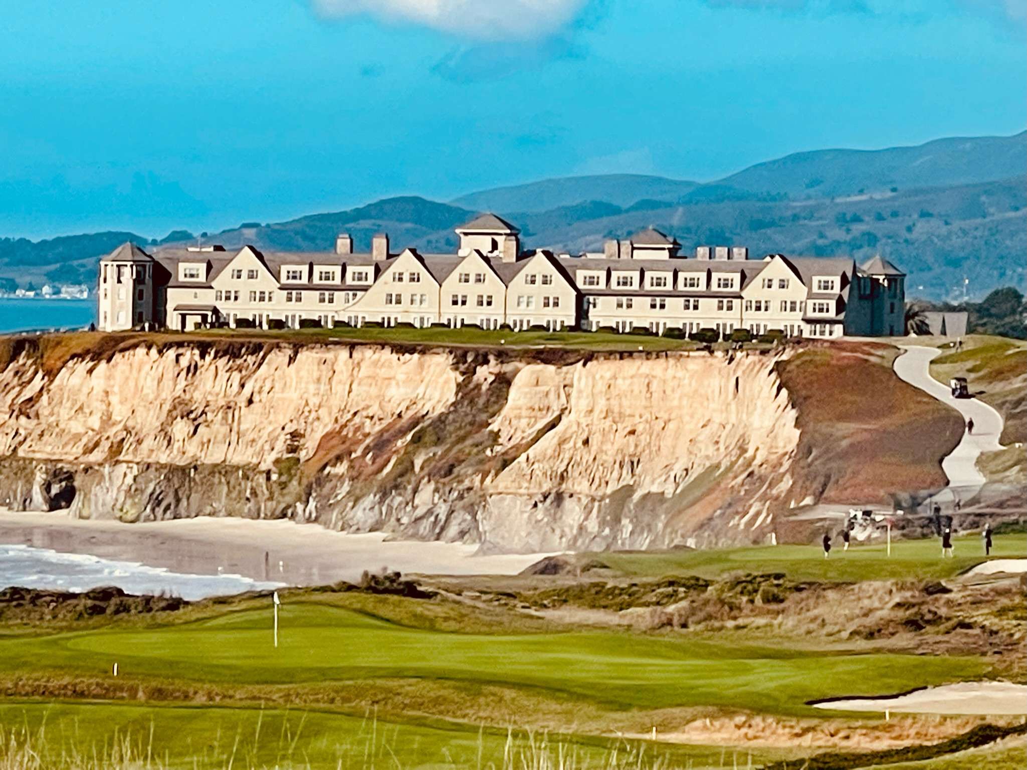 best couples golf trips: Distant view of Half Moon Bay